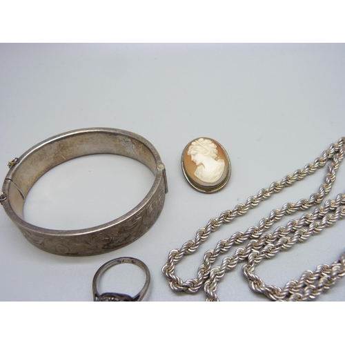 1109 - A collection of silver jewellery including a bangle, a cameo pendant/brooch and two chains, etc.