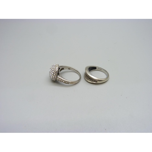 1110 - A silver and diamante ring and a silver stone set ring, M and O