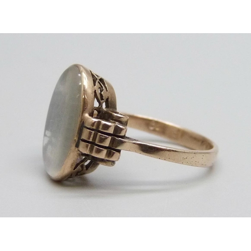 1123 - A yellow metal and moonstone ring, marks worn, 3.8g, O