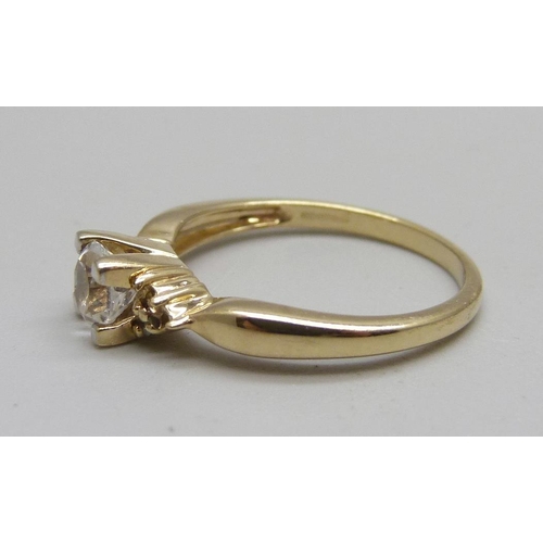 1133 - A 9ct gold and white sapphire ring, lacking one small stone, 2.6g, N