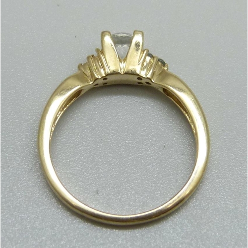 1133 - A 9ct gold and white sapphire ring, lacking one small stone, 2.6g, N