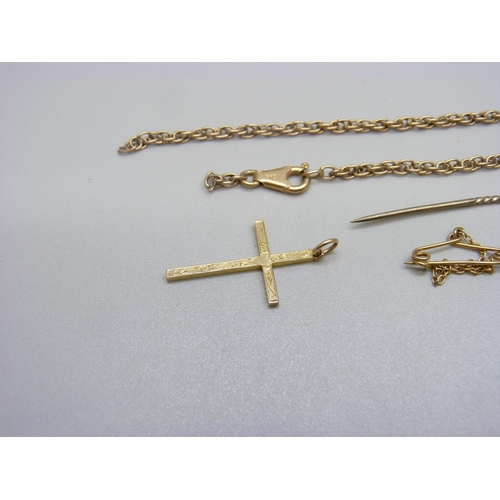 1144 - A 15ct gold stick pin, a 9ct gold cross pendant and a 9ct gold rope chain, a/f, 4.7g without stick p... 