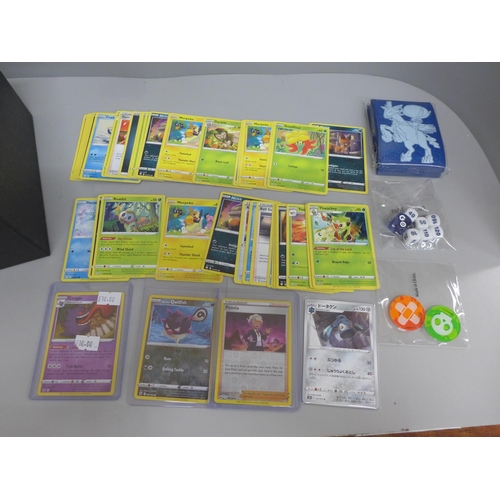 613 - 250 Assorted Pokemon cards including Holos, protective sleeve packs, dice and coins