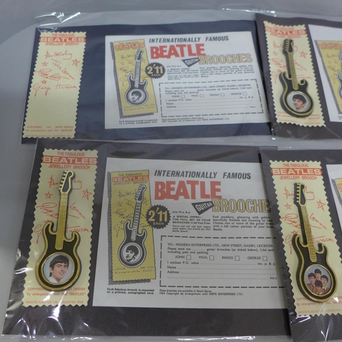 617 - The Beatles guitar brooches with later adverts order forms