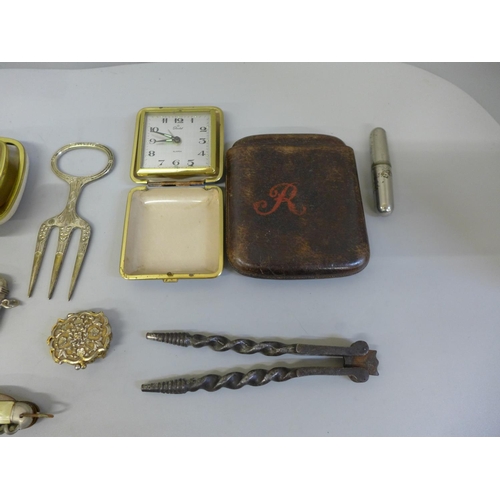 661 - Assorted items including a hip flask, vesta cases, travel clocks, etc.