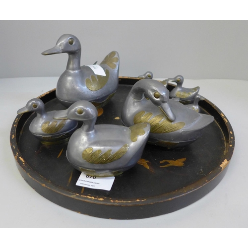 670 - A set of eight graduated duck pots, made in China, and a lacquered tray, tray a/f