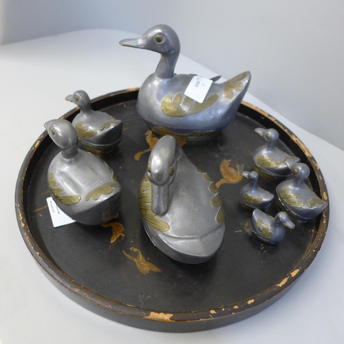 670 - A set of eight graduated duck pots, made in China, and a lacquered tray, tray a/f