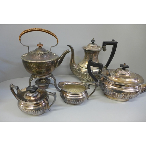 736 - A silver plated tea service and a silver plated teapot with stand and burner