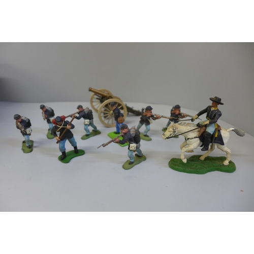 775 - A collection of Britains model figures, American Civil War including a cannon and two horses, approx... 