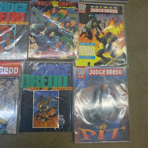 779 - Twelve Judge Dredd graphic novels and an encyclopedia