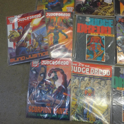 779 - Twelve Judge Dredd graphic novels and an encyclopedia