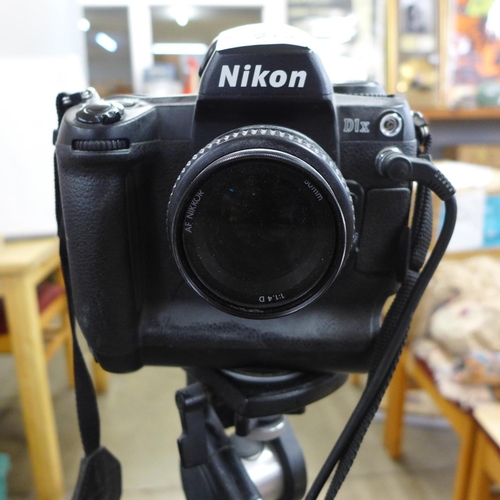 838 - A Nikon D1X camera with tripod