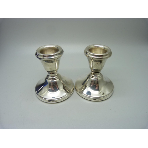 870 - A pair of small silver candlesticks in fitted case