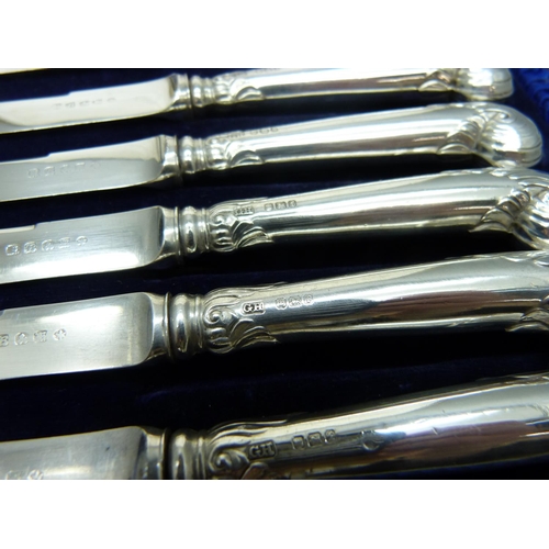 876 - A cased set of six silver handled pistol grip knives, Sheffield 1898