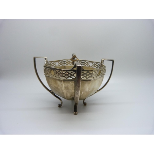 879 - A pierced silver four handled bowl with geometric sides, 195g