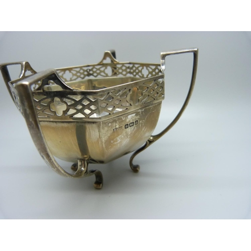 879 - A pierced silver four handled bowl with geometric sides, 195g