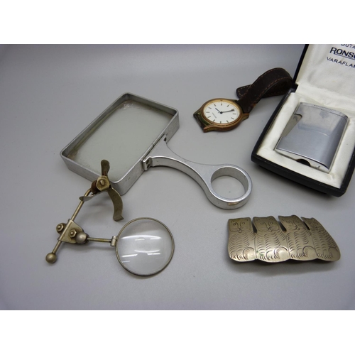 910 - A Ronson lighter, a Sekonda wristwatch and two magnifying glasses