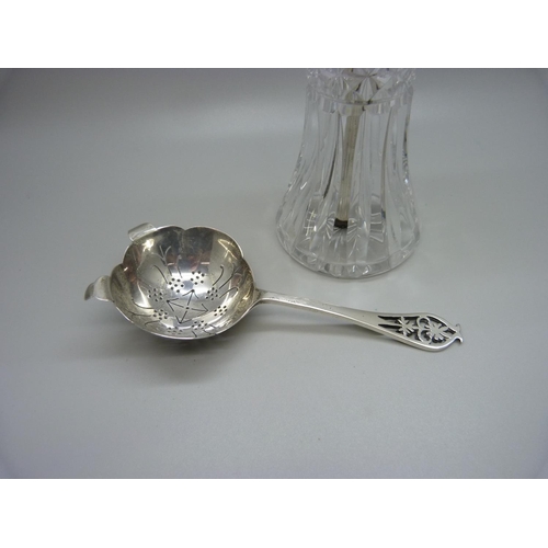 919 - A silver topped scent spray and a silver tea strainer, (strainer 46g)