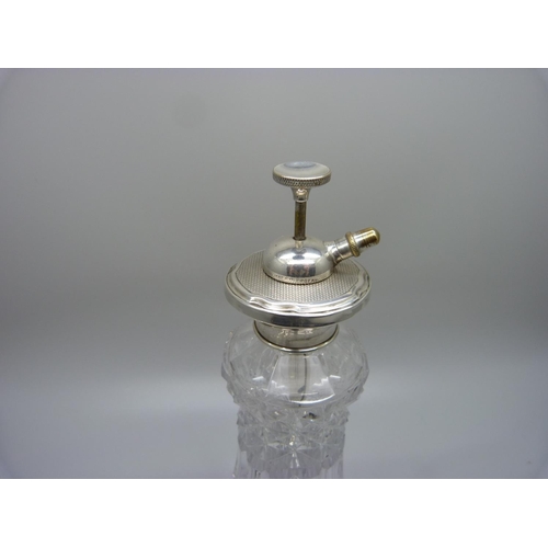 919 - A silver topped scent spray and a silver tea strainer, (strainer 46g)