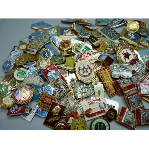 925 - A large collection of enamelled Russian badges