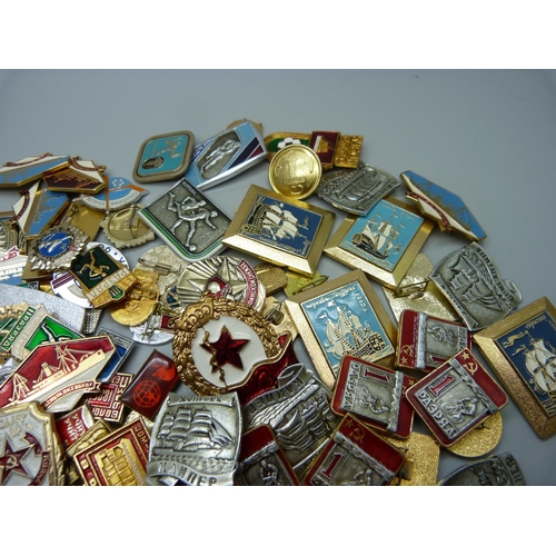 925 - A large collection of enamelled Russian badges