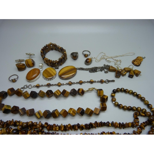 926 - A collection of tigers eye jewellery, some set in silver