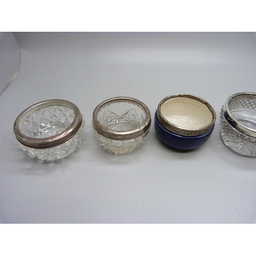 930 - A pair of silver mounted cut glass salts and four other silver rimmed salts