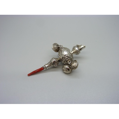 973 - A Victorian rattle/whistle with coral handle, tests as silver