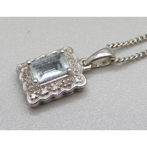 997 - A 9ct gold and aquamarine pendant with diamond accents and a 9ct gold chain, total weight 3.4g