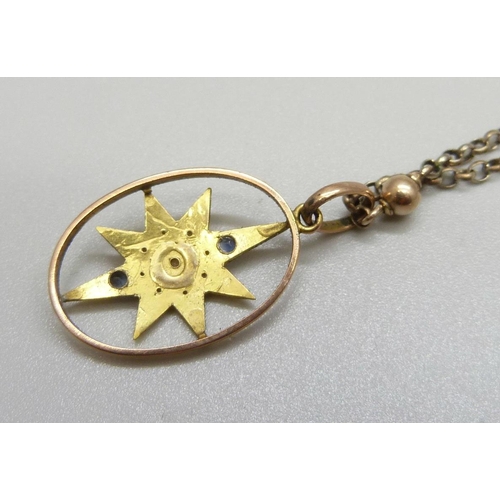 999 - An antique yellow metal, sapphire and pearl pendant on a chain