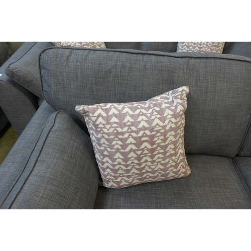 1301 - A pair of dark grey upholstered three seater sofas and a matching two seater sofa