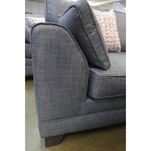 1301 - A pair of dark grey upholstered three seater sofas and a matching two seater sofa