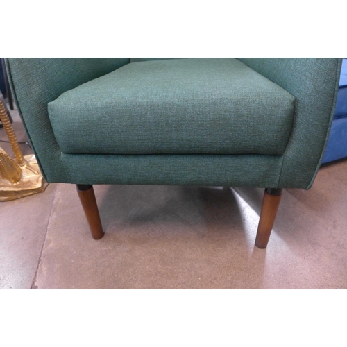 1305 - A forest green upholstered wingback armchair