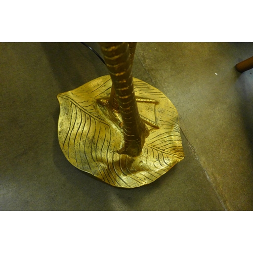 1306 - A large floor standing gold flamingo lamp with green velvet shade