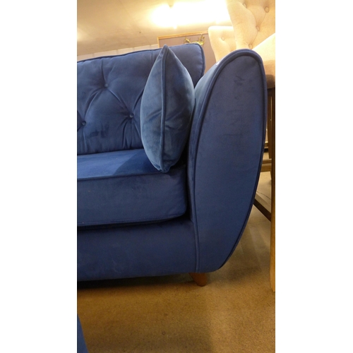 1307 - A Hoxton blue velvet three seater sofa