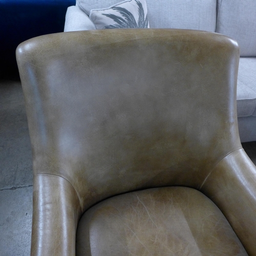 1375 - A light tan leather armchair