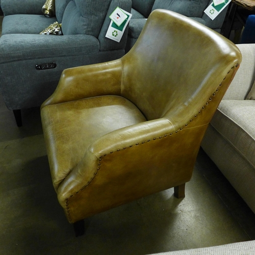 1375 - A light tan leather armchair