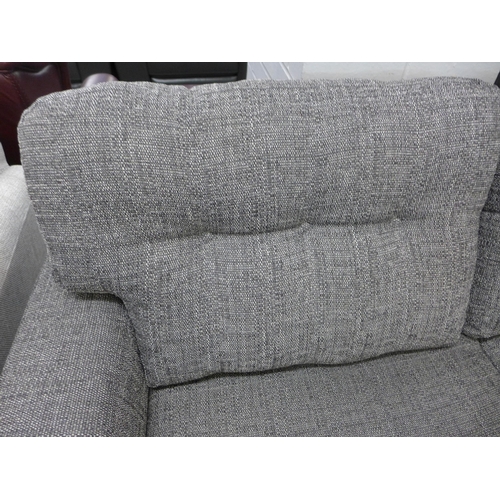 1387 - A charcoal upholstered three seater sofa