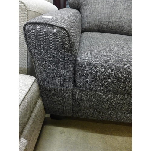 1387 - A charcoal upholstered three seater sofa