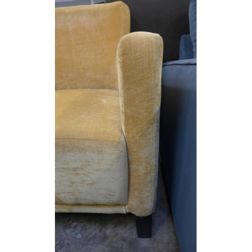 1424 - A mustard velvet armchair