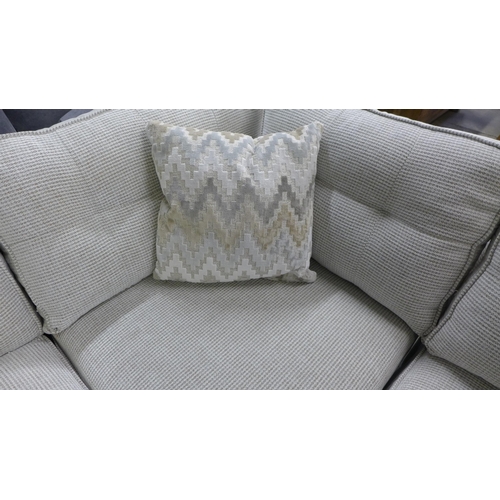 1449 - An oatmeal upholstered corner sofa