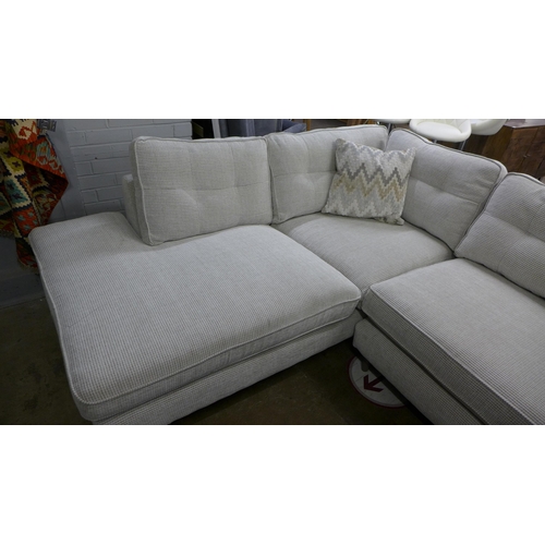 1449 - An oatmeal upholstered corner sofa