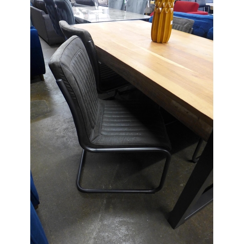 1495 - A Fire dining table and four grey upholstered cantilever chairs