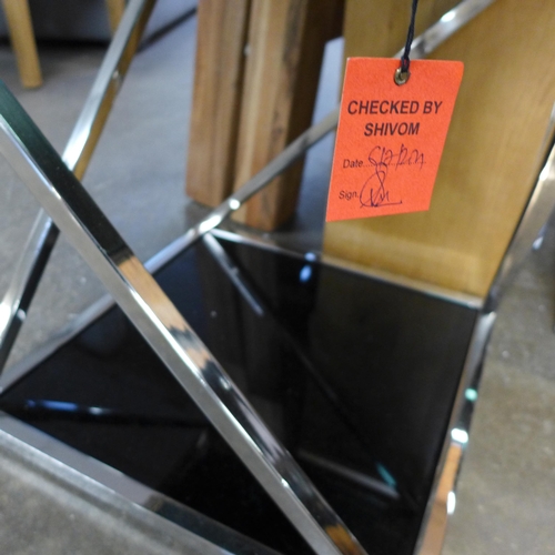 1521 - A chrome and black glass lamp table