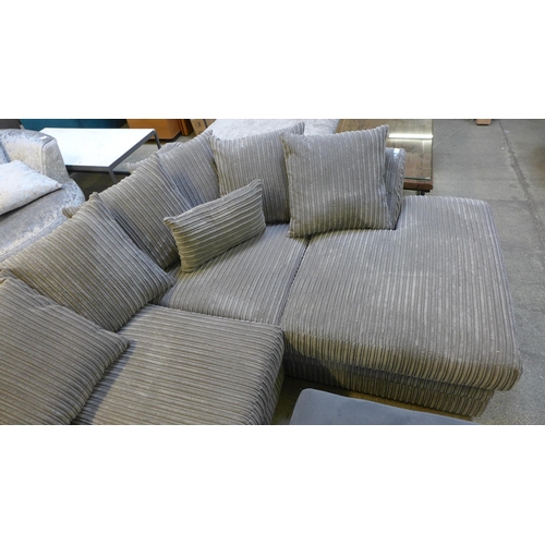 1530 - A grey upholstered jumbo cord corner sofa