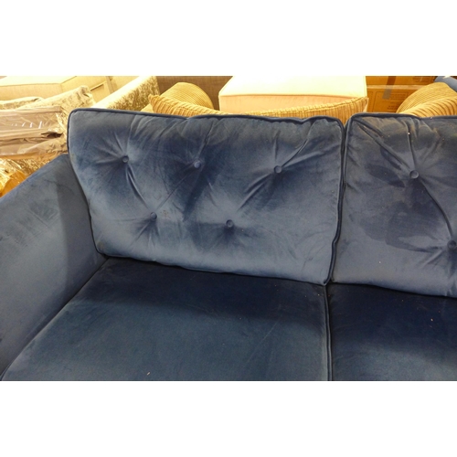 1561 - A Hoxton blue velvet three seater sofa - worn