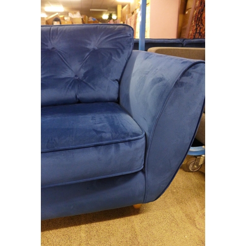 1561 - A Hoxton blue velvet three seater sofa - worn