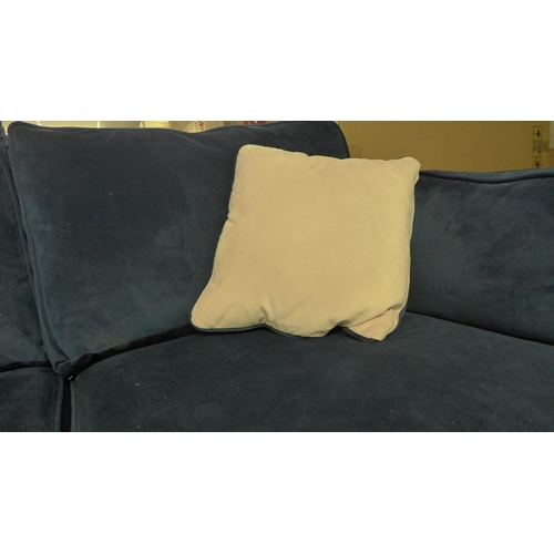 1562 - A blue velvet two seater sofa - damaged frame