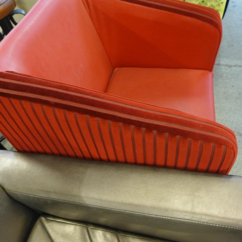 1570 - A red upholstered armchair