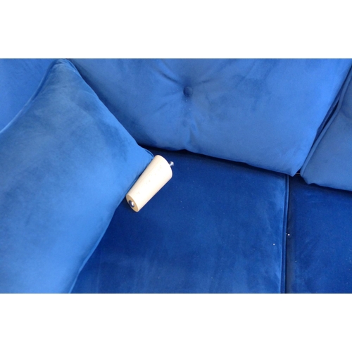 1572 - A Hoxton blue velvet two seater sofa - damaged leg